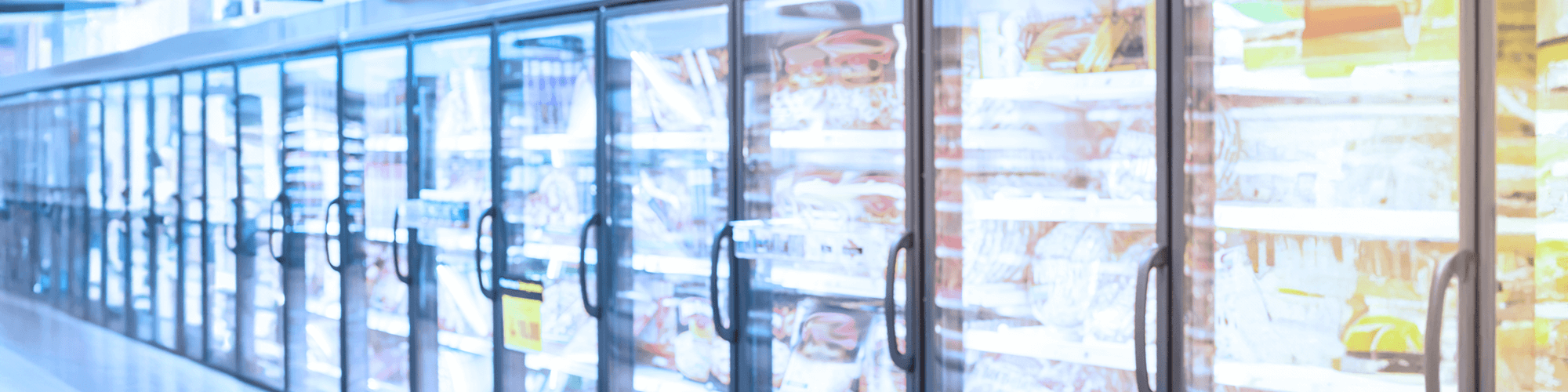 Frozen pizzas in freezer